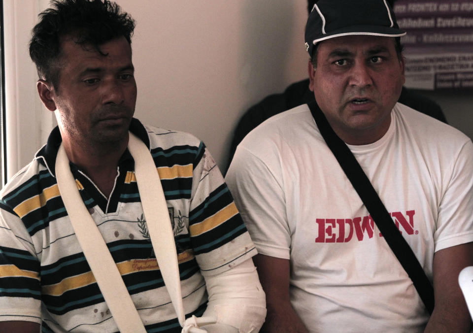 Indian migrant workers Nermal Chand, left and Vije Kumar who were attacked at their home by masked men near Athens, attend a news conference organized by anti-racism campaigners in Athens, Thursday, July 19, 2012. Human rights groups say racially motivated attacks have soared in Greece in recent months. The extreme right Golden Dawn party won 18 seats in parliament in elections last month. It denies direct involvement in the attacks. (AP Photo/Dimitri Messinis)