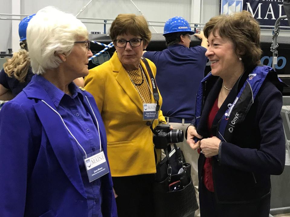 Sen. Susan Collins, R-Maine, right, at the University of Maine on Thursday after the school unveiled the world's largest 3D printer and boat created by a 3D printer.