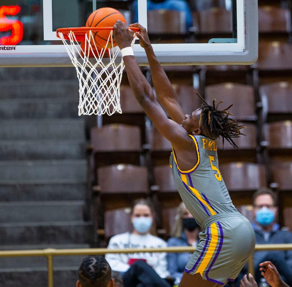 Legacy Early College's Coen Carr dunks during the LaLumiere vs. Legacy Early College NIBC Tournament basketball game Thursday, Jan. 6, 2022 at the LaPorte Civic Auditorium. 