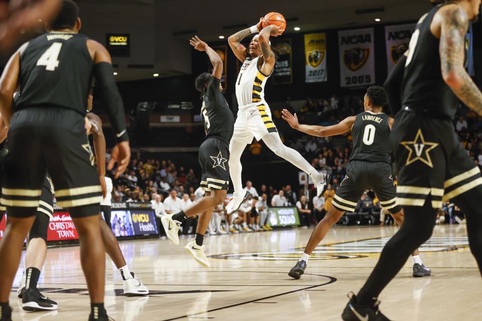 Virginia Commonwealth guard Ace Baldwin (1) is defended by Vanderbilt guard Ezra Manjon (5) during the first half of an NCAA college basketball game Wednesday, Nov. 30, 2022, in Richmond, Va. (Shaban Athuman/Richmond Times-Dispatch via AP)