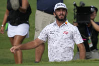 Max Homa jumps up from the bunker on the 18th during the weather delayed third round of the Tour Championship golf tournament at East Lake Golf Club Sunday, Aug. 28, 2022, in Atlanta. (AP Photo/Steve Helber)