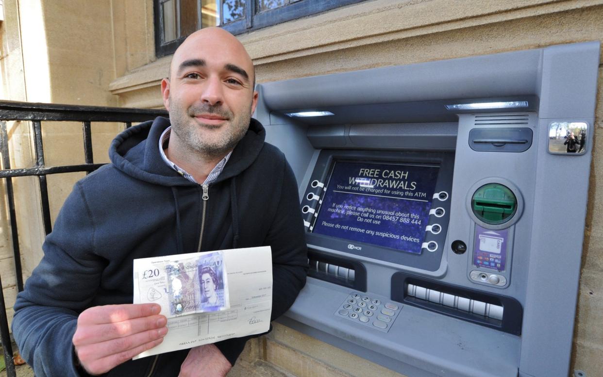 Steve Titman with his refund from NatWest  - Peterborough Telegraph / SWNS