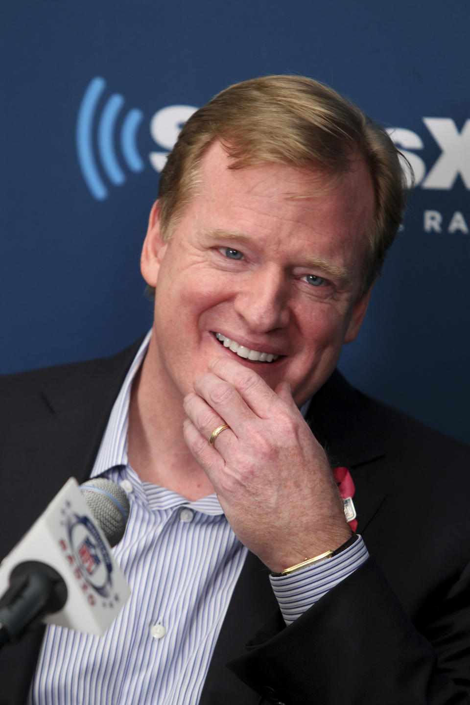 NFL Commissioner Roger Goodell talks with former New York Giants' Michael Strahan and football fans during a Sirius XM town hall, Monday, Oct. 22, 2012, in New York. (AP Photo/Seth Wenig)