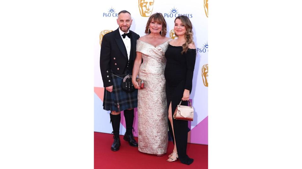 trio on red carpet at BAFTA Television Awards