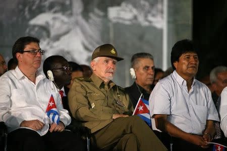 Cuba's Foreign Minister Bruno Rodriguez, Cuba's Commander of the Revolution Ramiro Valdes and Bolivia's President Evo Morales (L to R) attend a tribute in honor of former Cuban leader Fidel Castro in Santiago de Cuba, Cuba, December 3, 2016. REUTERS/Carlos Barria