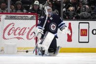 Winnipeg Jets goaltender Connor Hellebuyck gives up a goal on a shot from Los Angeles Kings defenseman Drew Doughty during the third period of an NHL hockey game Saturday, March 25, 2023, in Los Angeles. (AP Photo/Marcio Jose Sanchez)