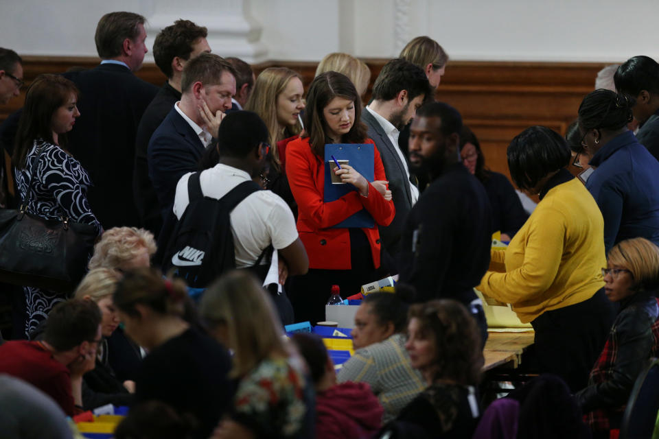 Candidates and their associates watch count volunteers sort ballot papers at Lindley Hall, Westminster, London, as counting begins across the UK in the local council elections.
