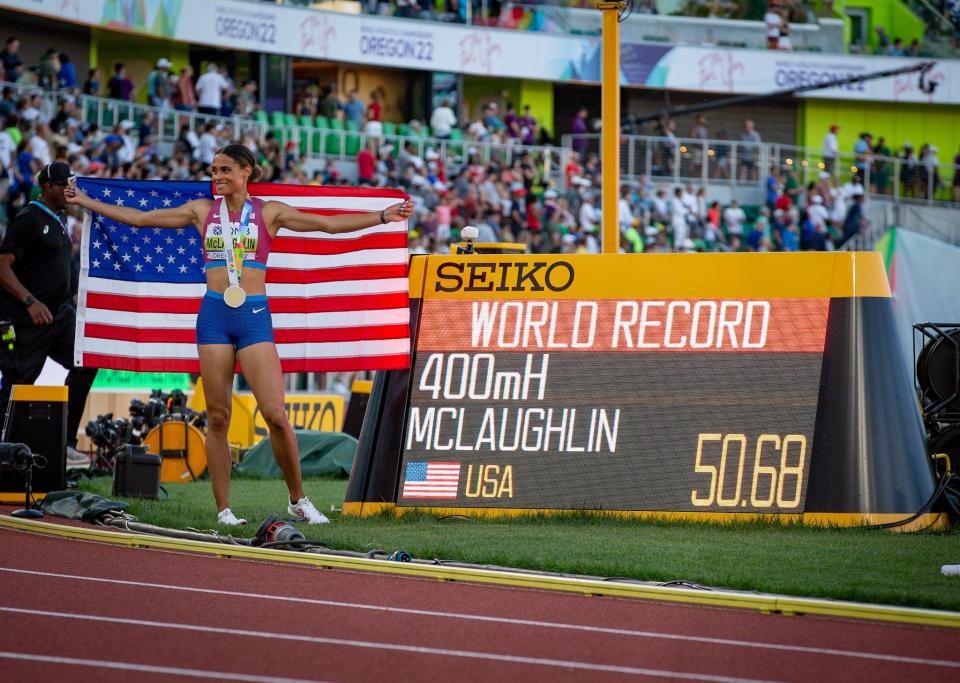 Sydney McLaughlin celebrates after setting the world record in the 400 hurdles for the third year in less than a year.