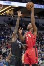 Apr 9, 2019; Minneapolis, MN, USA; Toronto Raptors forward Kawhi Leonard (2) shoots the ball over Minnesota Timberwolves center Gorgui Dieng (5) in the first half at Target Center. Mandatory Credit: Jesse Johnson-USA TODAY Sports