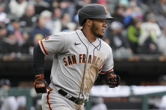 Mitch Haniger of the San Francisco Giants rounds the bases after