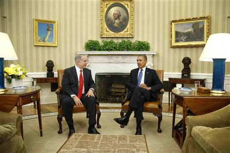 Israel's Prime Minister Benjamin Netanyahu (L) and U.S. President Barack Obama sit down to a meeting in the Oval Office of the White House in Washington March 3, 2014. REUTERS/Jonathan Ernst