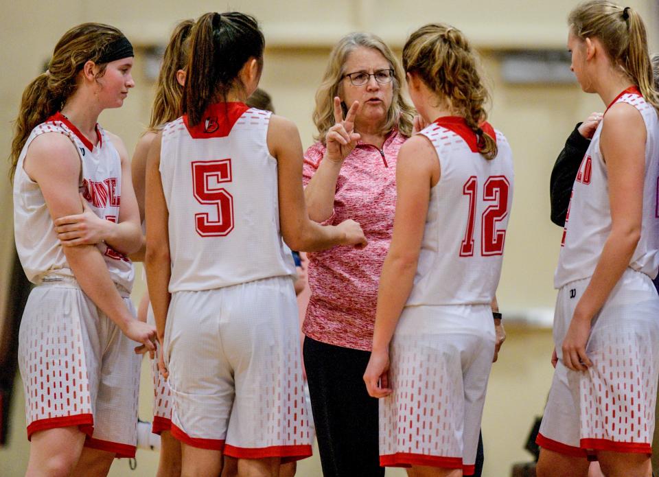 Brimfield coach Maribeth Dura makes plans during a break in a game against Farmington on Monday, Jan. 7, 2019 at Brimfield.