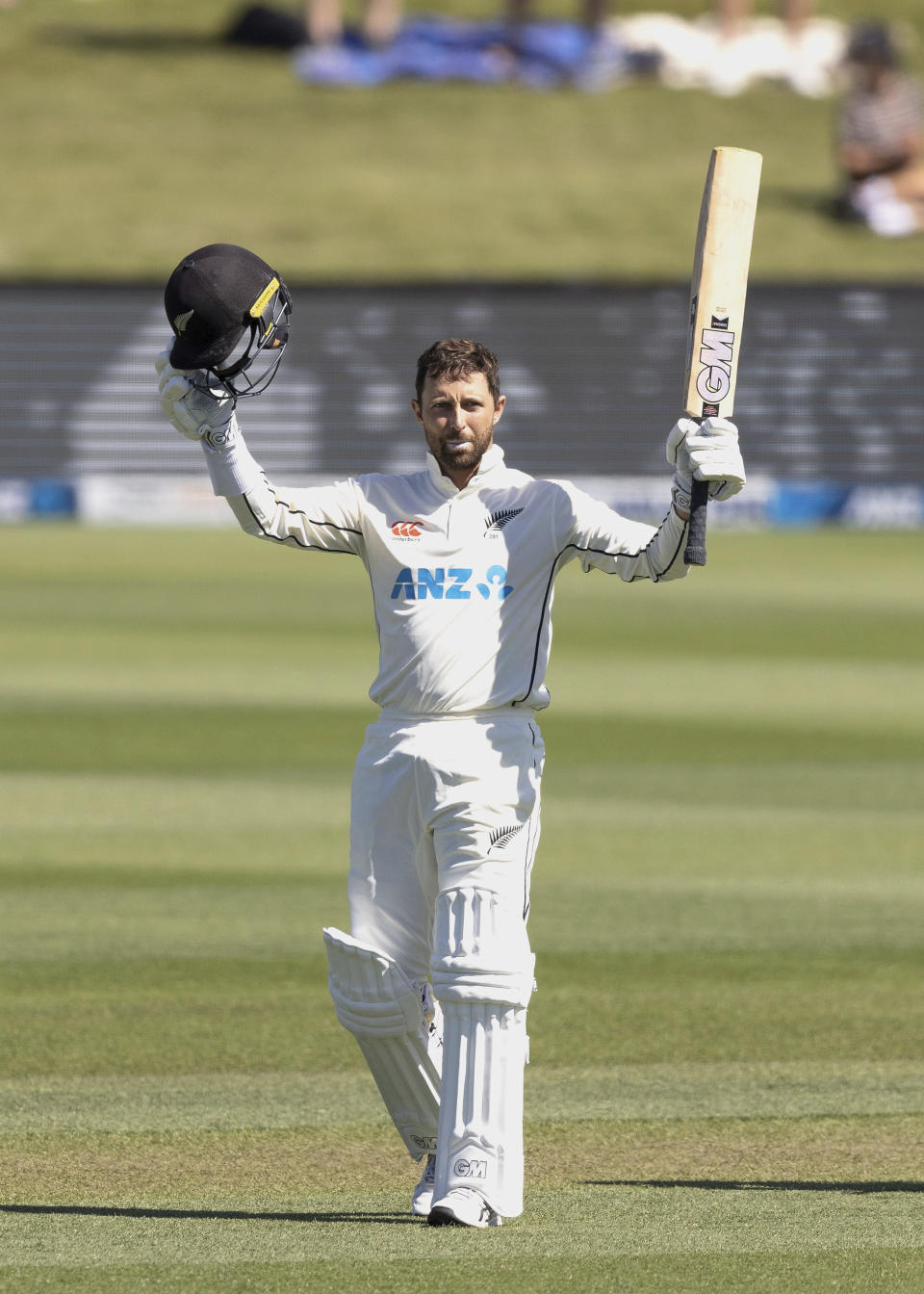 Devon Conway of New Zealand celebrates his century on day two of the second cricket test between Bangladesh and New Zealand at Hagley Oval in Christchurch, New Zealand, Monday, Jan. 10, 2022. (Martin Hunter/Photosport via AP)