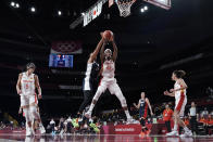 Spain's Astou Ndour (45) grabs a rebound in front of France's Iliana Rupert (12) during a women's basketball quarterfinal round game at the 2020 Summer Olympics, Wednesday, Aug. 4, 2021, in Saitama, Japan. (AP Photo/Eric Gay)