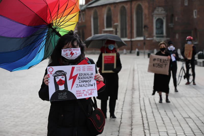 Activists protest against an initiative to tighten abortion rules in Krakow