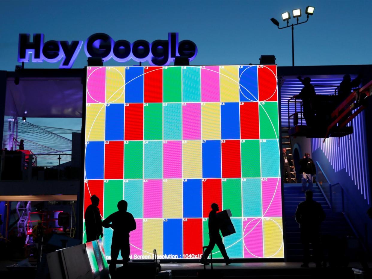 Technicians work on a Hey Google booth in front of the Las Vegas Convention Center in preparation for the 2018 CES in Las Vegas, Nevada, U.S. January 6, 2018: REUTERS/Steve Marcus