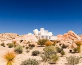 <p>One of the most striking shipping container buildings in the world, Joshua Tree Residence by Whitaker Studio is located in the California desert and comprised of a starburst-like conglomeration of white containers.</p>
