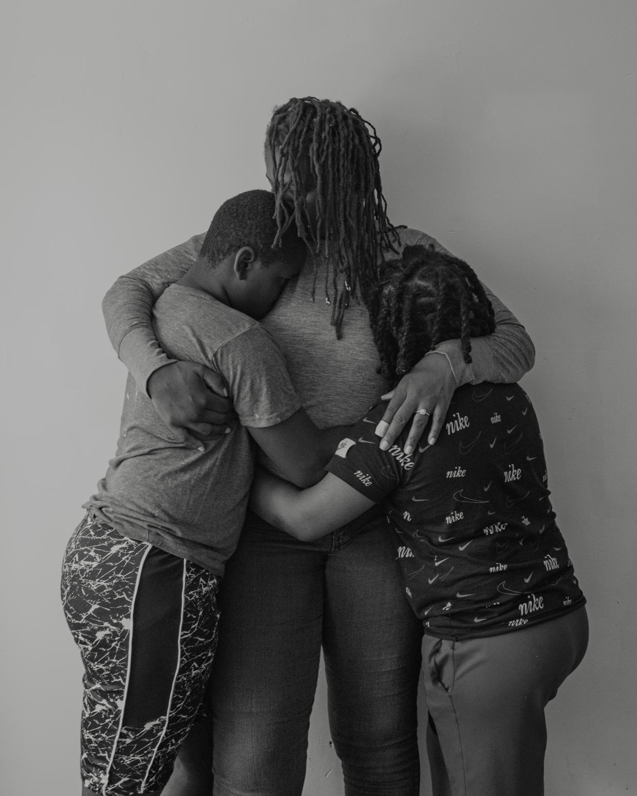 Portrait of Ronisha and her sons in embrace. (Stephanie Mei-Ling for NBC News and ProPublica)