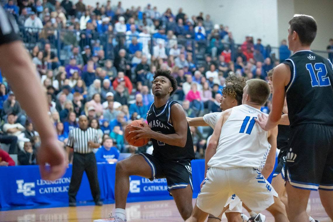 Mason County’s Terrell Henry (2) drives to the basket against Bracken County in the opening round of the White, Greer & Maggard Holiday Classic at Lexington Catholic High School on Tuesday.