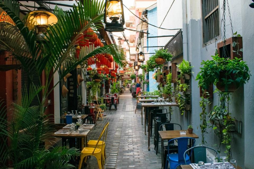 Quiet little street covered with plants in Siem Reap. It looks like it fell out of France as it retains its old French heritage.