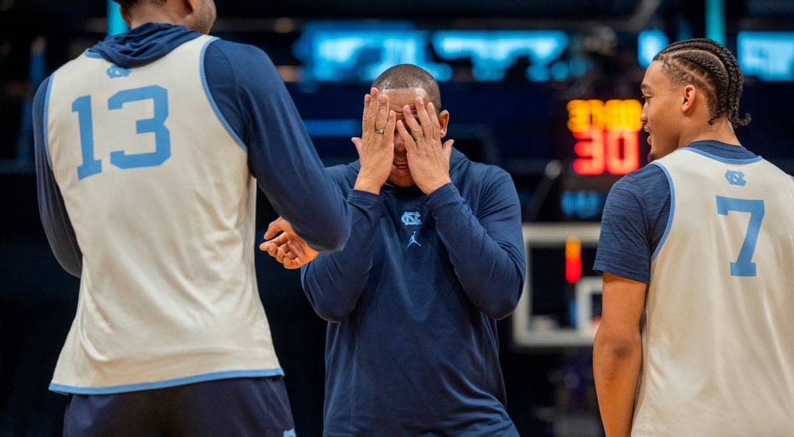 North Carolina coach Hubert Davis jokes around with Jalen Washington (13) and Seth Trimble (7) during their practice on Wednesday, March 20, 2024 as they prepare for the NCAA Tournament at Spectrum Center in Charlotte, N.C.