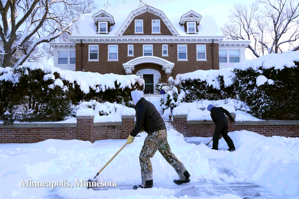 People clear snow from sidewalk in Minnesota and Angels Gate Lighthouse in San Pedro