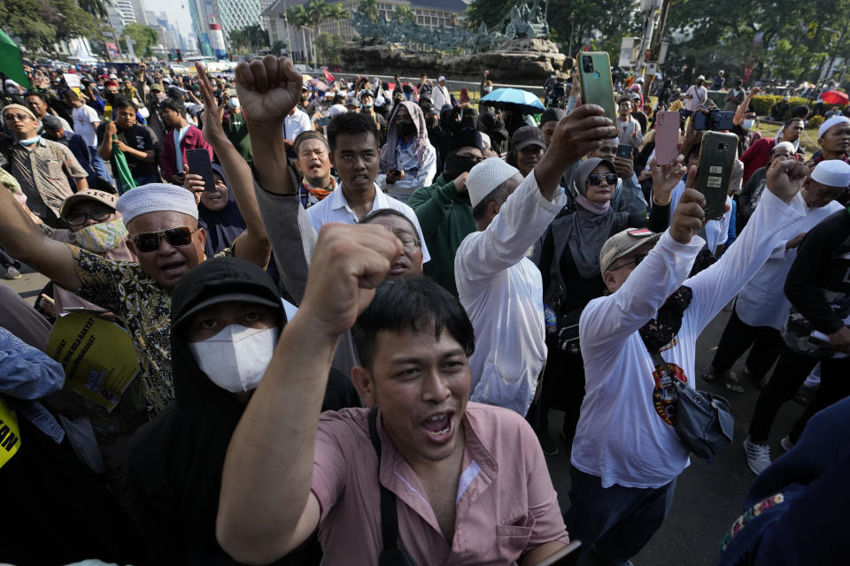 Protesters shout slogans during a rally against sharp increases in fuel prices in Jakarta, Indonesia, Monday, Sept. 12, 2022. Hundreds of conservative Muslims marched in Indonesia's capital on Monday demanding that the government revoke its decision to raise fuel prices, saying it hurts people already reeling from the economic impact of the pandemic. (AP Photo/Achmad Ibrahim)