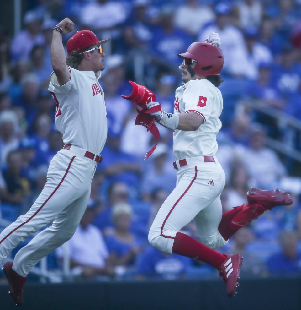 Indiana's Phllip Glasser, right, celebrates his home run with teammate Josh Pyne, left, on the Hoosiers' first pitch the team saw in the bottom of the first inning. The Hoosiers defeated Kentucky 5-3 Saturday night in the 2023 NCAA Regional at Kentucky Proud Park in Lexington. June 3, 2023.