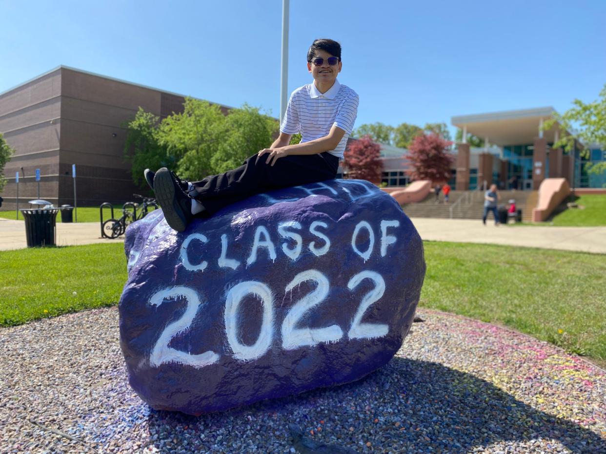 Alex Nowicki, a 2022 graduate of Lakeview High School, poses for a photograph outside the high school in Battle Creek, Mich. on Tuesday, May 24, 2022.