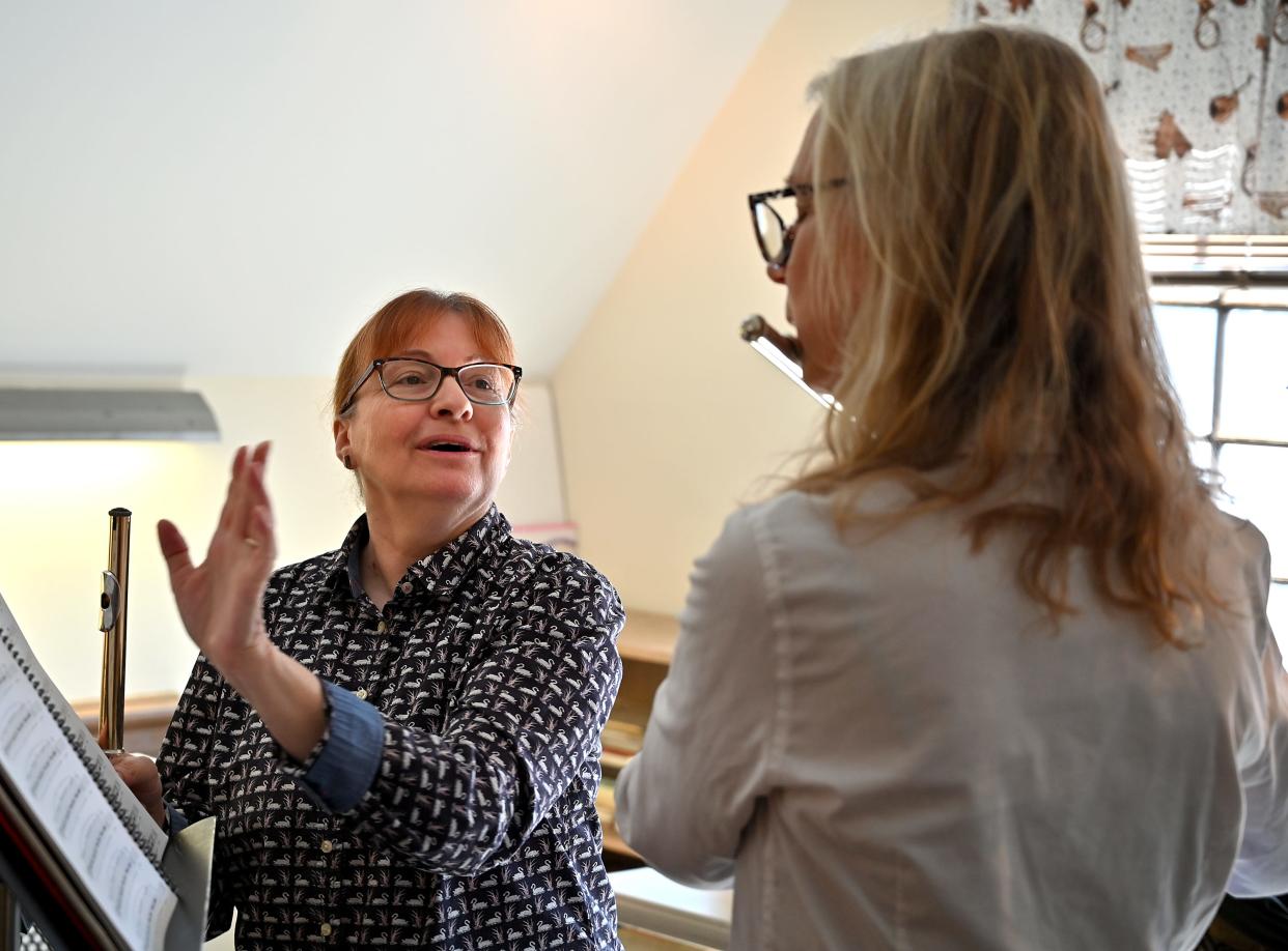 Sarah Smongeski, who is retiring after 30 years as executive director of Pakachoag Music School, teaches flute to Lynn Fantelli of Upton