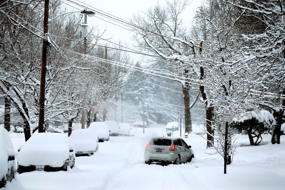 A car gets stuck in the snow on Cascade Road in Forest Park, Ohio Sunday January 13, 2019. Four inches of snow has fallen in the northern suburbs of Cincinnati, as snow continues to fall. (Via OlyDrop)