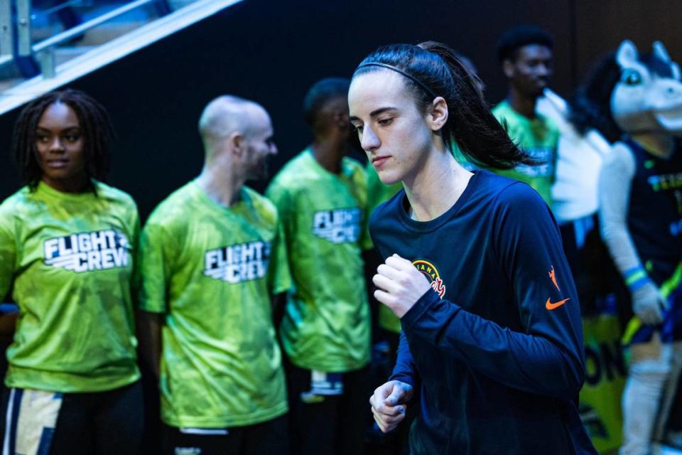 Indiana Fever guard Caitlin Clark runs out of the tunnel prior to a WNBA preseason game against the Dallas Wings at College Park Center in Arlington on Friday, May 3, 2024. Clark is making her highly anticipated professional debut after going as the number one pick in the 2024 draft.