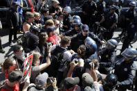 <p>Protesters confront San Francisco Police officers outside of Alamo Square Park in San Francisco, Saturday, Aug. 26, 2017. (Photo: Marcio Jose Sanchez/AP) </p>