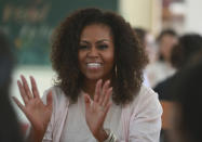 Former U.S. first lady Michelle Obama speaks to female students at the Can Giuoc high school in Long An province, Vietnam, Monday, Dec. 9, 2019. Mrs. Obama is on a visit to Vietnam to promote education for adolescent girls. (AP Photo/Hau Dinh)