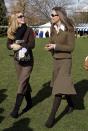 <p>Wearing a tweed skirt suit on the first day of the Cheltenham Horse Racing Festival in Cheltenham, England.<br></p>