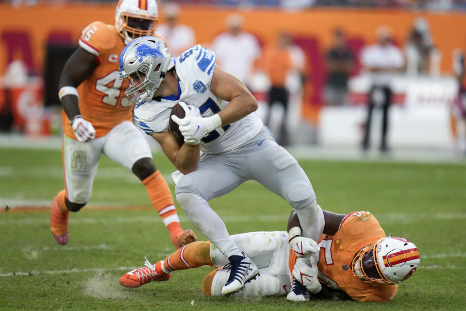 Detroit Lions tight end Brock Wright (89) is brought down by Tampa Bay Buccaneers linebacker Lavonte David (54) during the second half of an NFL football game Sunday, Oct. 15, 2023, in Tampa, Fla. (AP Photo/Chris O'Meara)