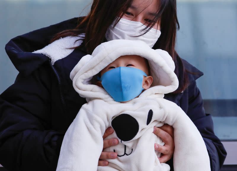 A family members wearing protective masks is seen in Sapporo, Hokkaido