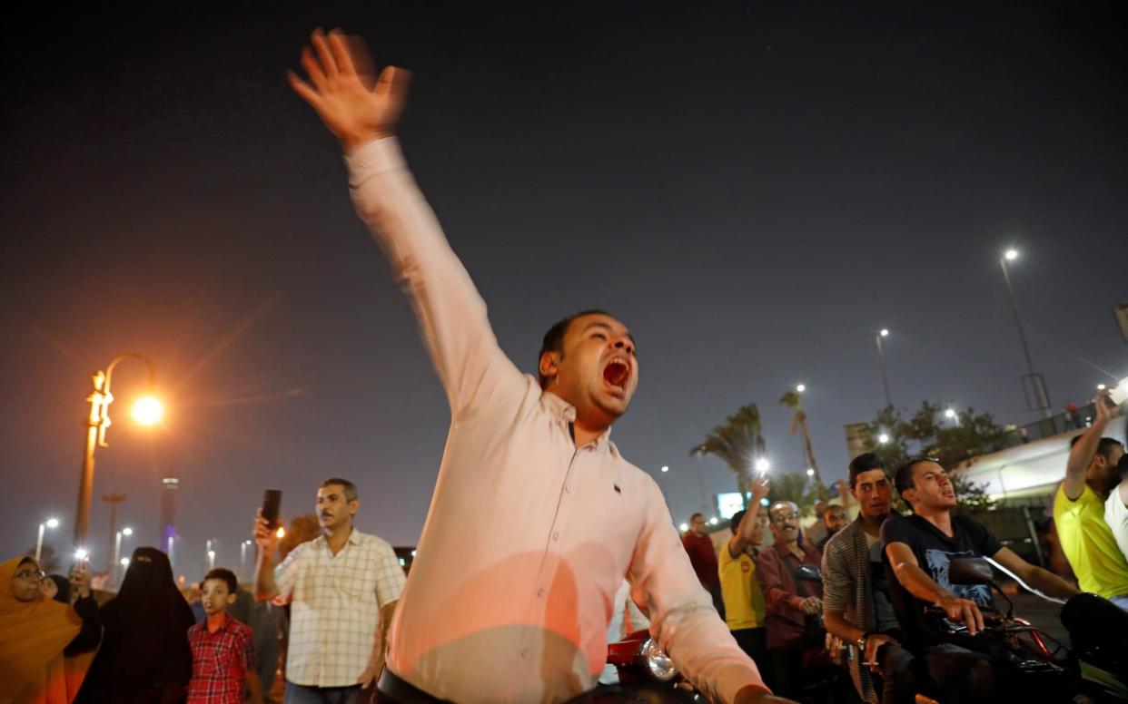 Small groups of protesters gather in central Cairo shouting anti-government slogans in Cairo - REUTERS