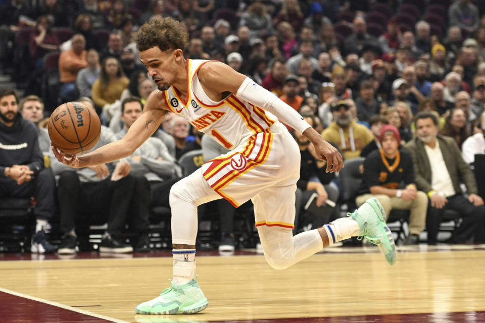 Atlanta Hawks guard Trae Young rebounds a shot during the first half of an NBA basketball game against the Cleveland Cavaliers, Monday, Nov. 21, 2022, in Cleveland. (AP Photo/Nick Cammett)