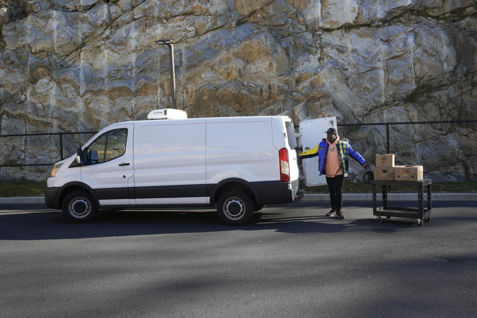 Michael Williams of the Carver Center loads food recovered from a ShopRite into his van in Elmsford, N.Y., Wednesday, Nov. 15, 2023. A growing number of states are working to keep food out of landfills over concerns that it is taking up too much space and posing environmental problems. Some states including New York are requiring supermarkets and other businesses to redirect food to food pantries. (AP Photo/Seth Wenig)