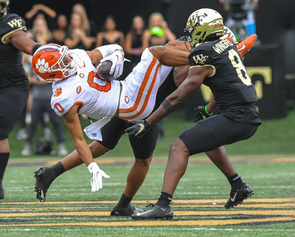 Clemson wide receiver Antonio Williams(0) holds on to a pass near Wake Forest defensive back Isaiah Wingfield (8) during the second quarter at Truist Field in Winston-Salem, North Carolina Saturday, September 24, 2022.    