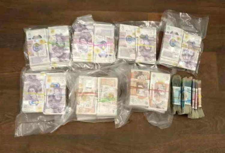 A mobile phone image of cash sent by the gang. (SWNS)