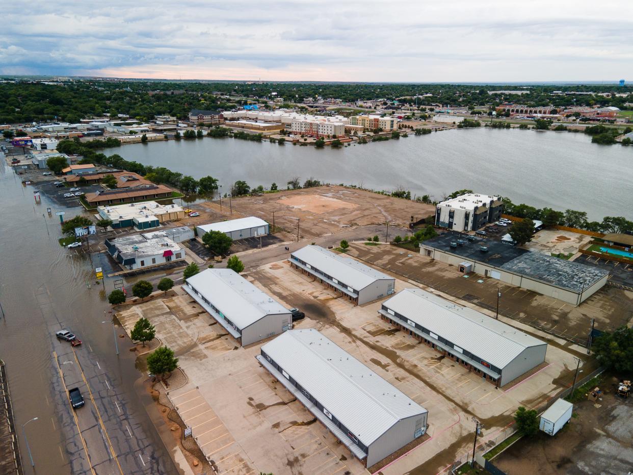 Lawrence Lake flooded over its banks into the streets, leading to closures during flash flooding in Amarillo last spring, as seen in this file photo. Intake structures at the playa lake sustained damage, likely due to aging and the heavy flood waters, the city said.