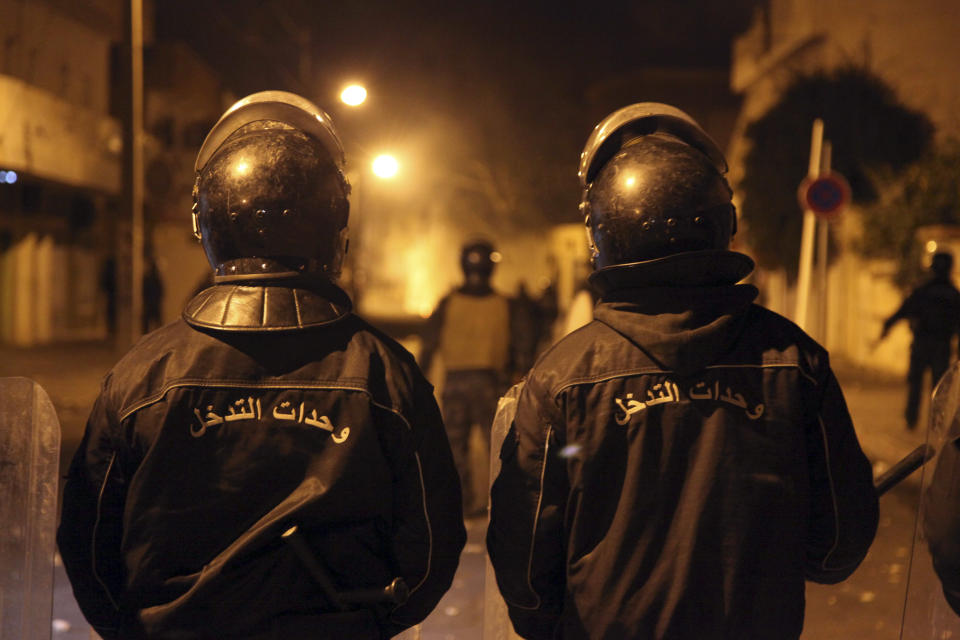 Tunisian Police officers patrol after clashes in the streets of Kasserine, southern of Tunisia, Wednesday, Dec 26, 2018.The death of a Tunisian journalist Abderrak Zorgui who set himself on fire to protest economic problems in the North African nation prompted a protest that led to clashes with police and nationwide concern. (AP Photo/Walid Ben Sassi)