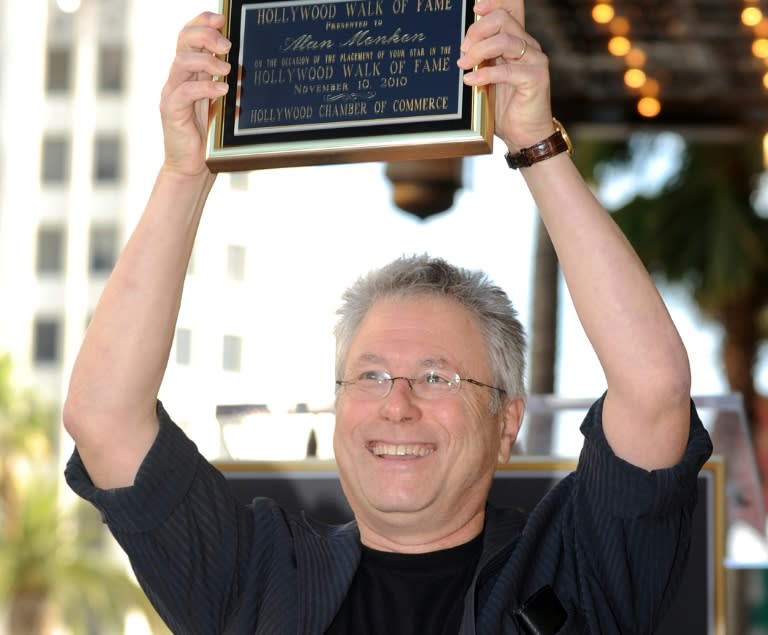 Composer Alan Menken poses after being honored with a Star on the Hollywood Walk of Fame in 2010