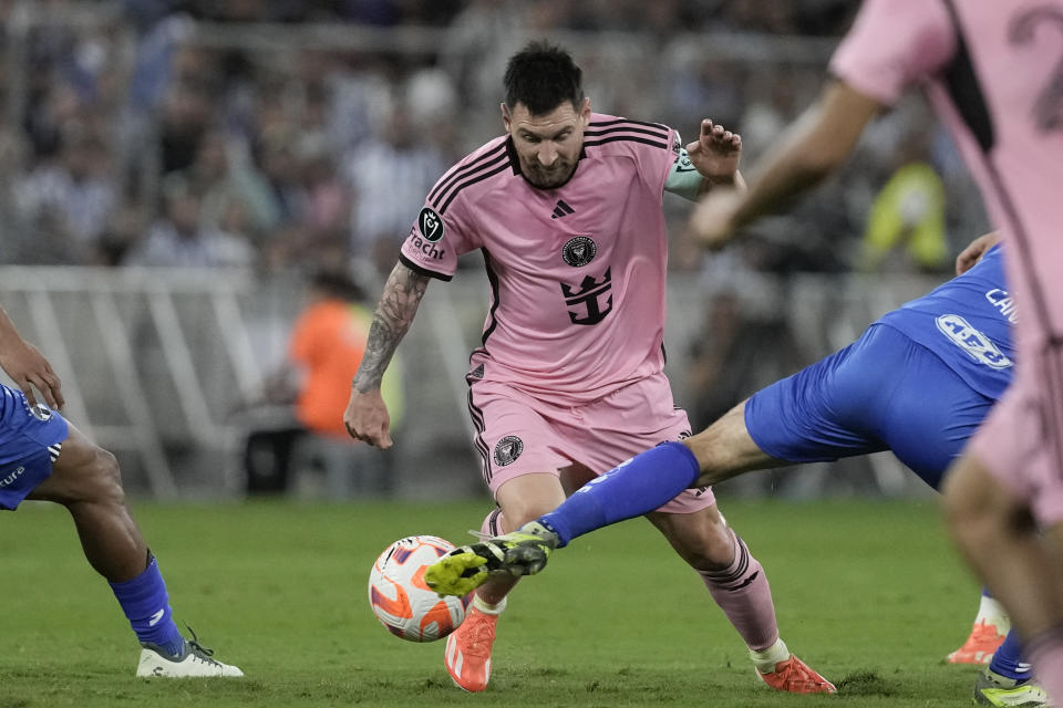 Inter Miami's Lionel Messi is fouled by Monterrey Sergio Canales during a CONCACAF Champions Cup quarter final second leg soccer match at the BBVA stadium in Monterrey, Mexico, Wednesday, April 10, 2024. (AP Photo/Eduardo Verdugo)