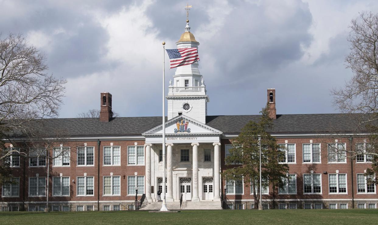 An American flag flies in front of Bunce Hall at Rowan University in Glassboro, on Monday, March 28, 2022.  