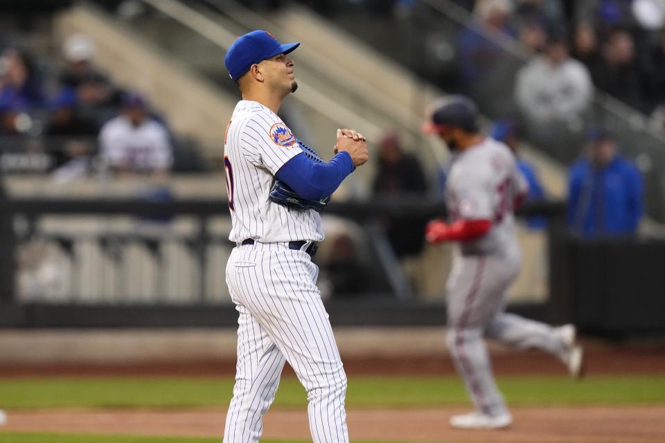 New York Mets starting pitcher Jose Butto waits as Washington Nationals' Keibert Ruiz runs the bases after hitting a home run during the second inning of a baseball game Tuesday, April 25, 2023, in New York. (AP Photo/Frank Franklin II)