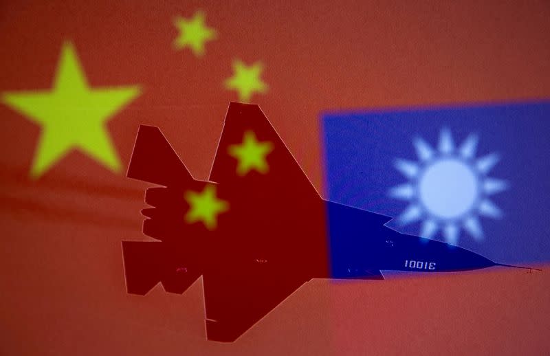 FILE PHOTO: FILE PHOTO: Chinese, Taiwanese flags and military airplanes displayed in this illustration