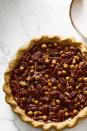 <p>Toasted pecans, walnuts and hazelnuts are suspended in a salty-sweet layer of decadent salted caramel for pure dessert perfection.</p><p><em><a href="https://www.goodhousekeeping.com/food-recipes/a46628/salted-caramel-mixed-nut-pie-recipe/" rel="nofollow noopener" target="_blank" data-ylk="slk:Get the recipe for Salted Caramel Mixed Nut Pie »;elm:context_link;itc:0;sec:content-canvas" class="link ">Get the recipe for Salted Caramel Mixed Nut Pie »</a></em> </p>